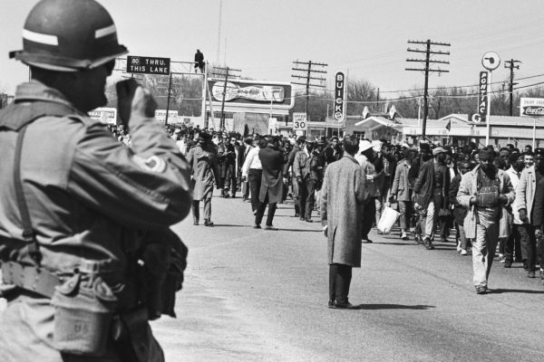 When President Lyndon B. Johnson federalized the National Guard, it meant that the President took control of National Guard units from their respective states, placing them under federal authority. This action allowed the federal government to deploy these troops for national purposes, such as enforcing federal laws or responding to crises beyond state lines.
A significant example of this occurred during the Civil Rights Movement and the Watts Riots in the 1960s. Johnson federalized the California National Guard in 1965 to help restore order during the Watts Riots, giving the federal government direct control to manage the situation more effectively. This move bypassed potential delays or conflicts with state leadership.
In general, federalizing the National Guard grants the President the power to quickly mobilize troops nationwide, ensuring a unified response to emergencies, but it can also create tension between state and federal governments over control of military forces.